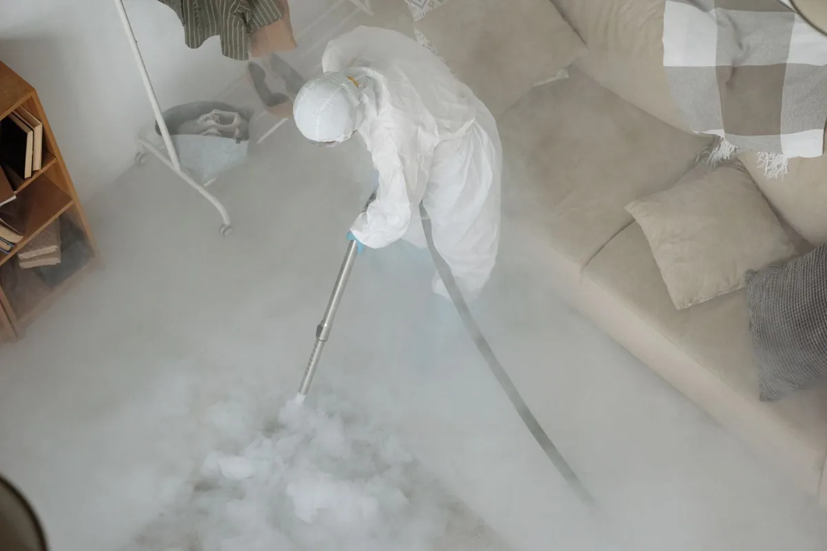 Biohazard cleanup technician in protective equipment, Union, OR
